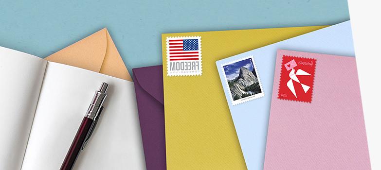 Assortment of colored envelopes with the Love, Waterfalls, and U.S. Flag 一流的邮件 Forever stamps.